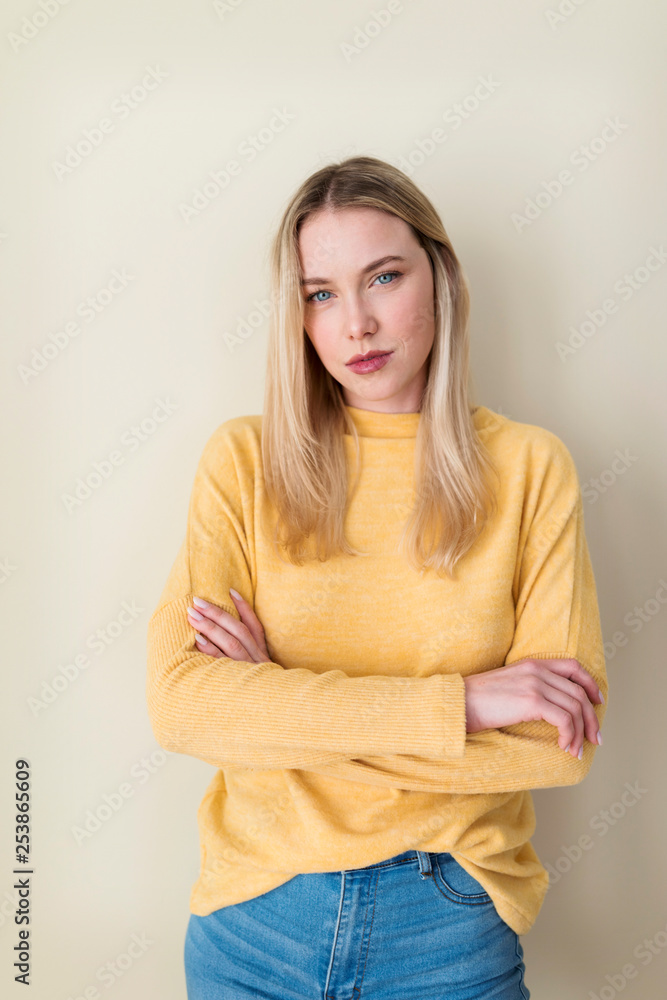 Portrait of a young woman, with arms crossed Portrait of a young woman, with arms crossed