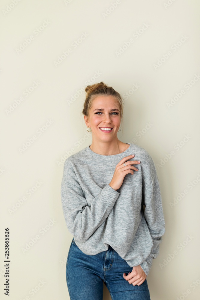 Portrait of a young woman, smiling Portrait of a young woman, smiling