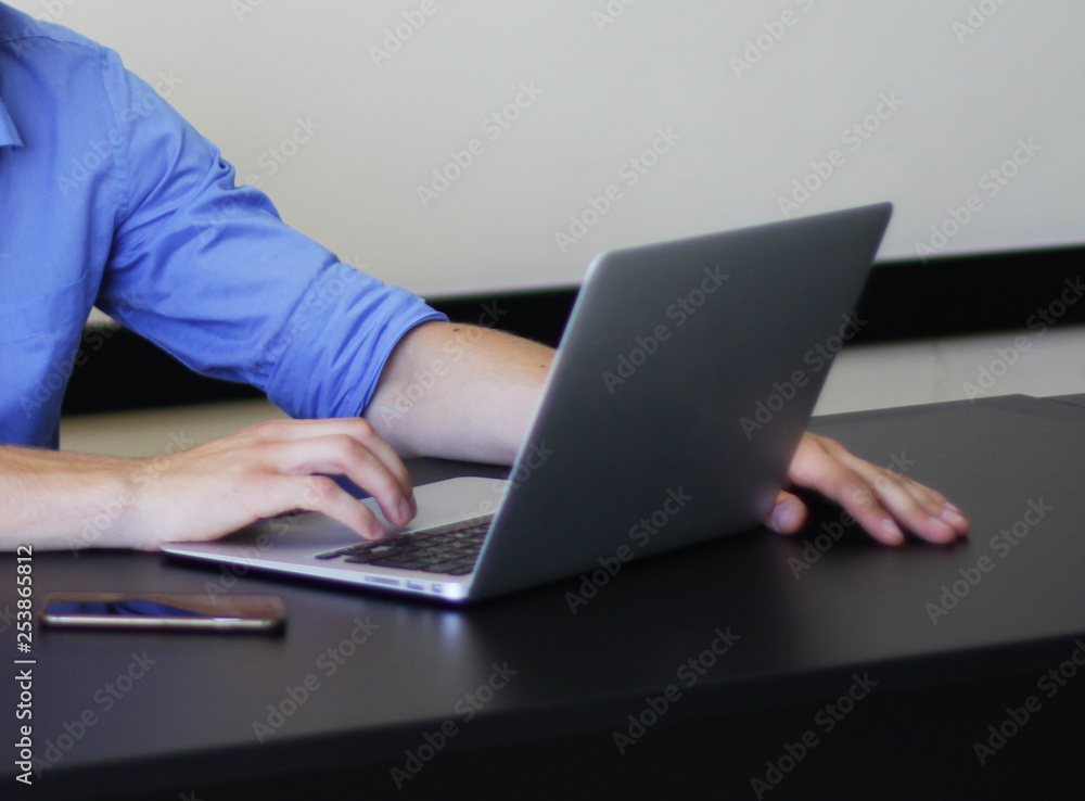 Man working with computer in the office Man working with computer in the office