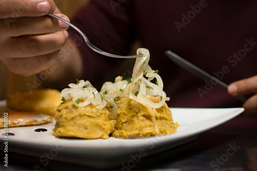 Dominican food mangu with onion photo