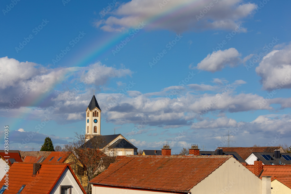 Christian Church in background of rainbow in Frankenthal Germany