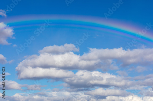 Rainbow in Blue sky with cloud in Germany