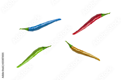 Multicolored chili peppers on an isolated white background, peppers pattern