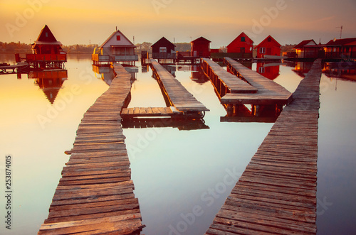 Wooden cottages on the Bokod lake in Hungary photo