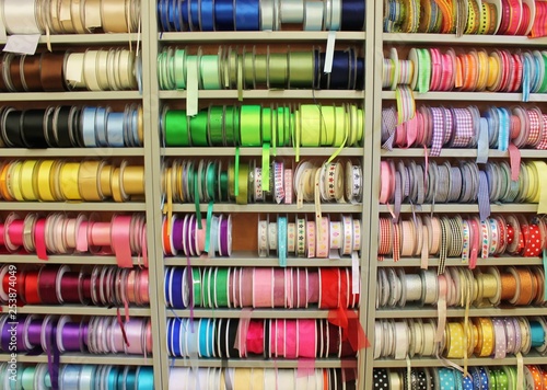 sewing haberdashery haberdasher ribbon reels rolls rows and trims in fabric retail shop  sew sewing supplies for sale retail shop market rainbow stock, photo, photograph, image, picture,  photo