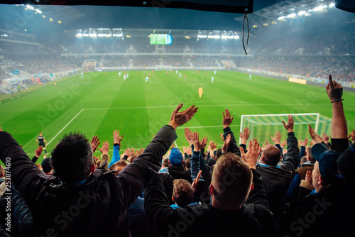 Fototapeta Naklejka Na Ścianę i Meble -  Photo – crowded soccer stadium, football fans support the team