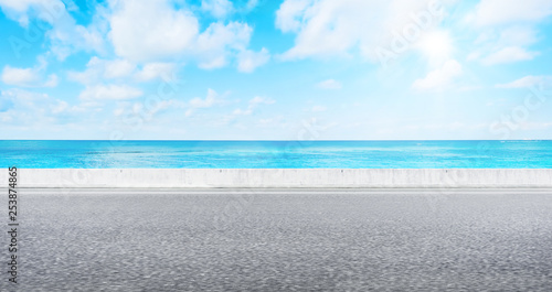Fototapeta Naklejka Na Ścianę i Meble -  Empty asphalt road with sea and sky for mockup