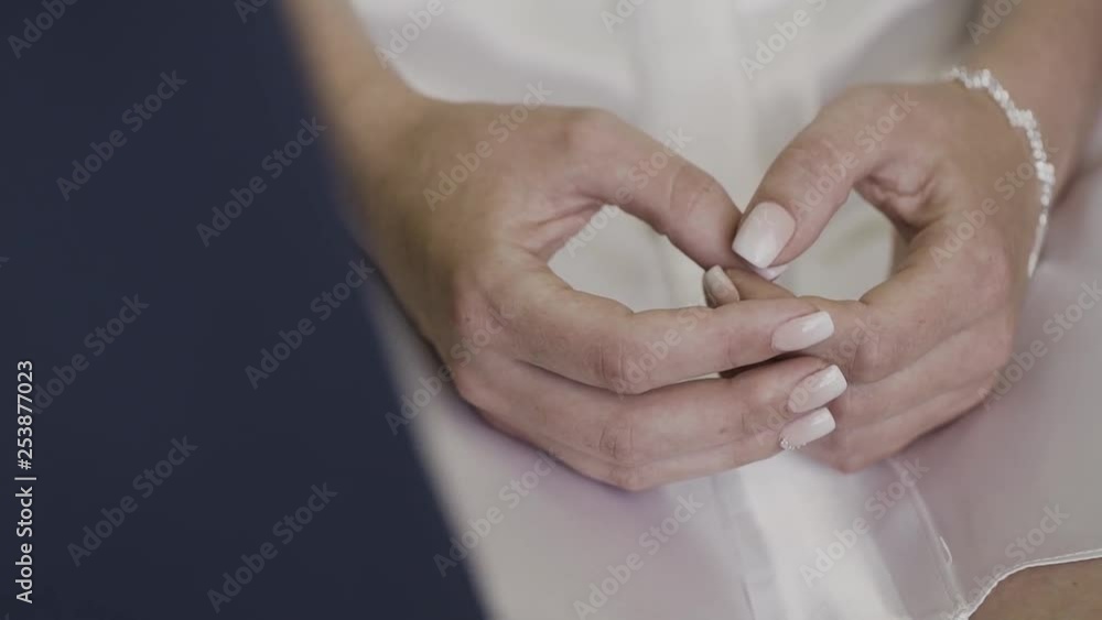 Beautiful hands of a young woman on her knees. Beautiful hands of a young woman on her knees.