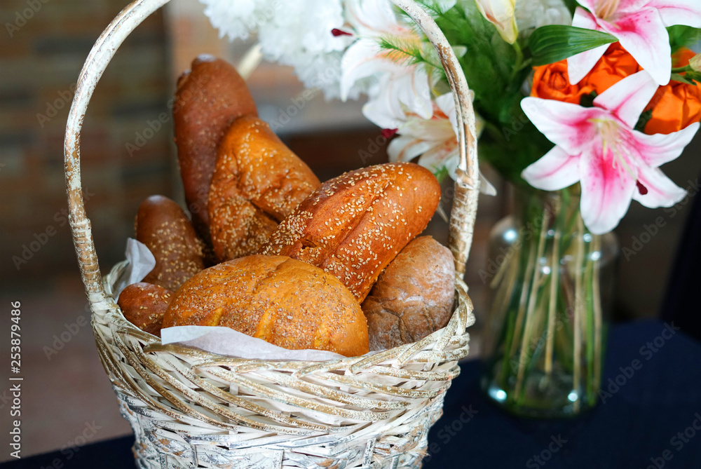  fresh baked bread in the basket with lily flower