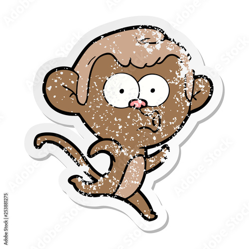 distressed sticker of a cartoon surprised monkey