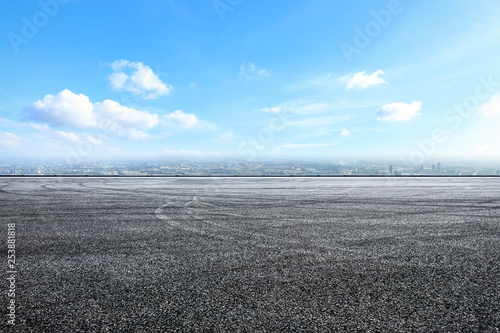 Empty asphalt road ground over modern city