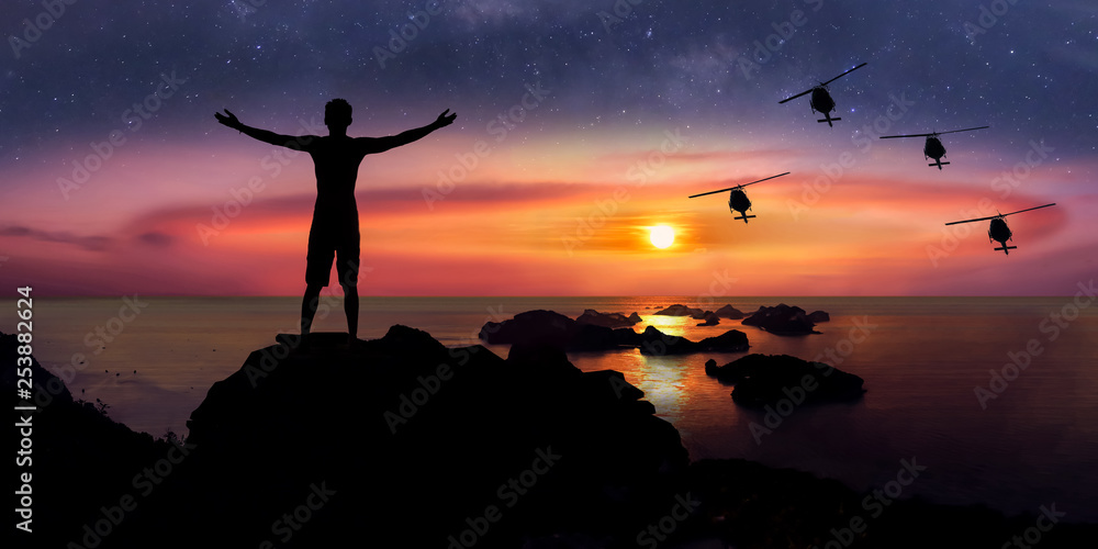 Man standing on the mountain with panorama view and million stars galaxy