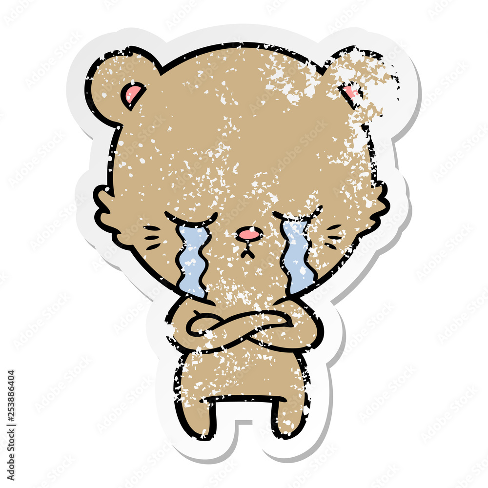 distressed sticker of a crying cartoon bear with folded arms distressed sticker of a crying cartoon bear with folded arms