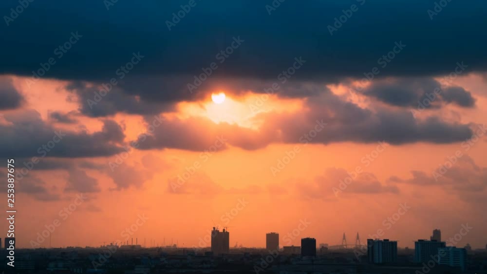 4K Time lapse sunset and beautiful dramatic twilight fluffy storm cloudy blue and yellow sky smoothly flowing to fantastic mind. Rainny good evening and have a nice day concept on cityscape. 4K Time lapse sunset and beautiful dramatic twilight fluffy storm cloudy blue and yellow sky smoothly flowing to fantastic mind. Rainny good evening and have a nice day concept on cityscape.