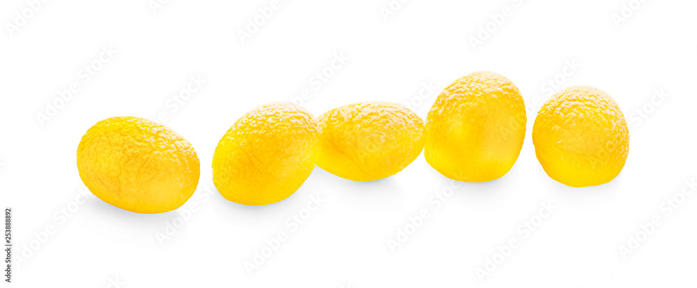 yellow thai silkworm cocoons pile isolated on white background.