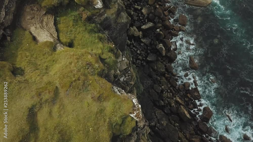 Steep and rough cliffs in North Scotland filmed as aerial footage by a drone Steep and rough cliffs in North Scotland filmed as aerial footage by a drone