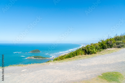 Summit track and beaches and sea stretching to horizon