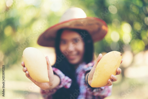 Young Asian farmer picking ...