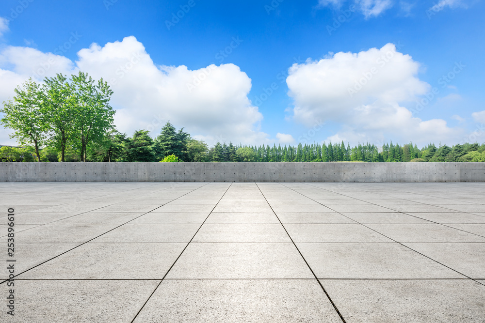 Empty square floor and green forest in the city park Empty square floor and green forest in the city park