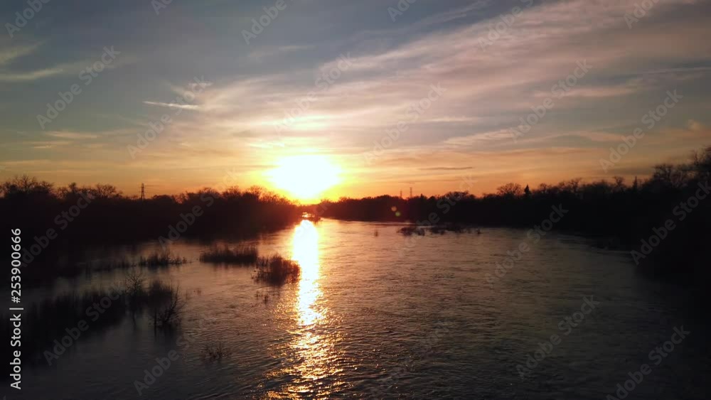 A very full river at sunset A very full river at sunset