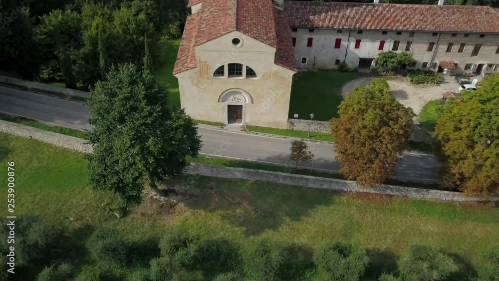 rotating around a church in italian countryside with a street in front rotating around a church in italian countryside with a street in front