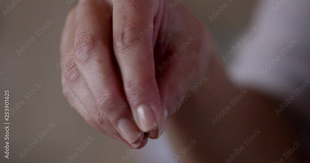 slow motion shot of pepper being sprinkled by hand slow motion shot of pepper being sprinkled by hand