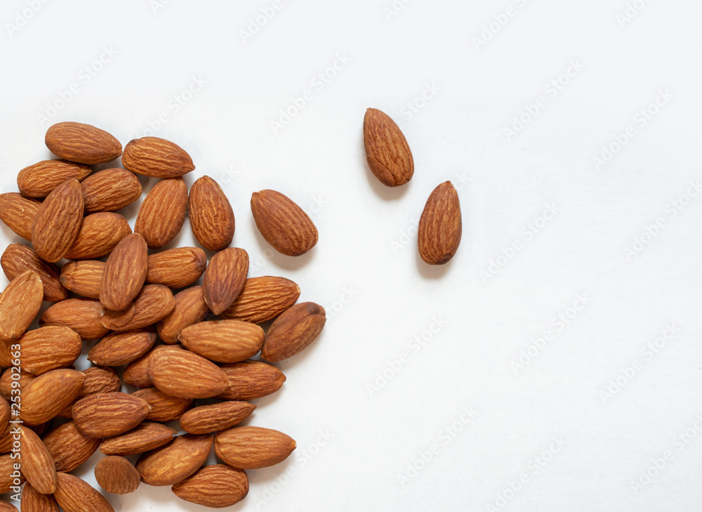 Roasted almonds on white background Roasted almonds on white background