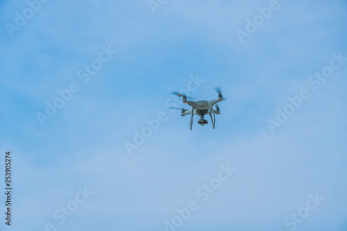Fototapeta Naklejka Na Ścianę i Meble -  flying drone with blue sky ocean island background