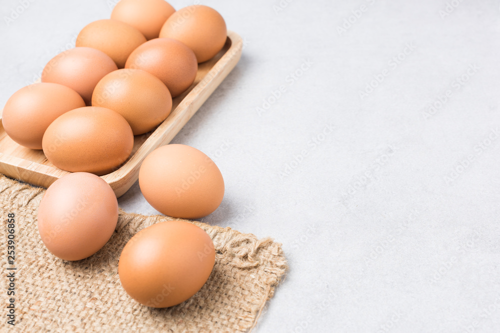 Fresh Eggs (chicken) Close-up with stone white background. Fresh Eggs (chicken) Close-up with stone white background.