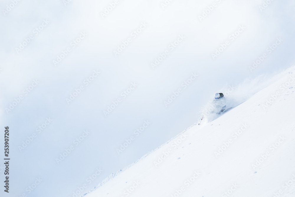 Woman telemark skiing in the backcountry of Hokkaido, Japan