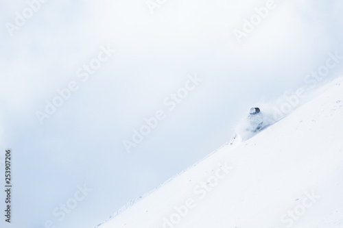 Woman telemark skiing in the backcountry of Hokkaido, Japan