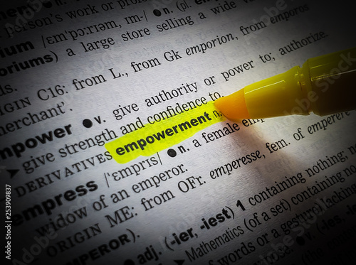 Fotografía A close up of the word:  empowerment,in a dictionary, highlighted in yellow and showing part of its definition