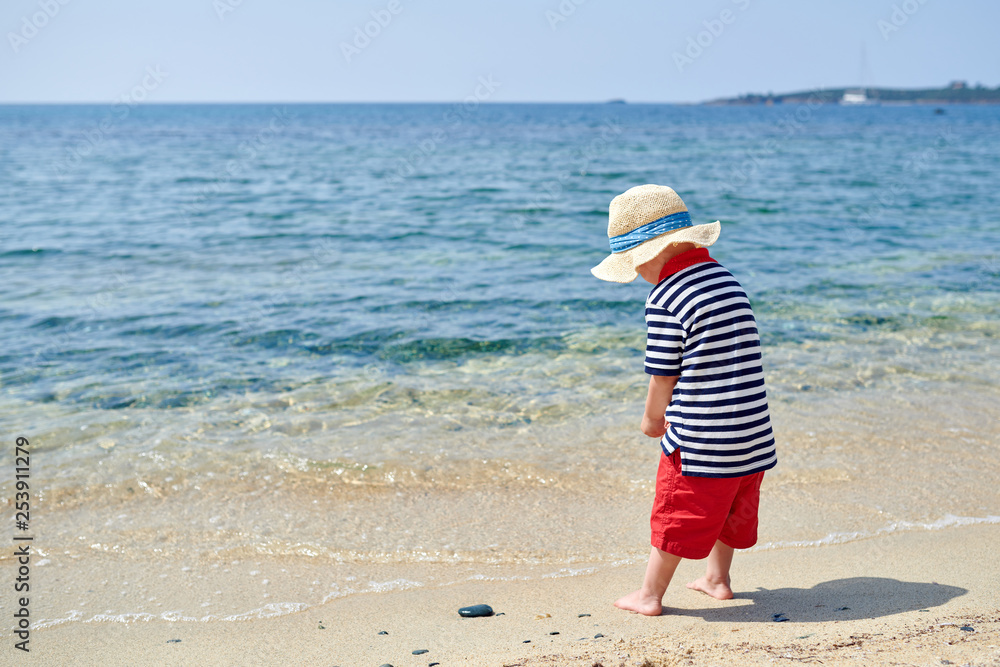 Toddler boy on beach