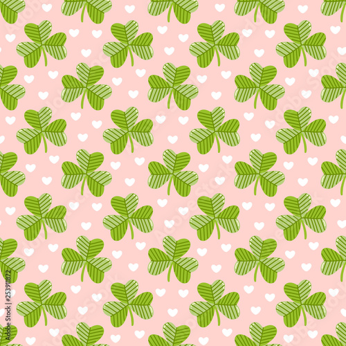 Seamless pattern with clover on a pink background with hearts, for St. Patrick's Day. Excellent design for packaging, wrapping paper, textile, clothes and etc.