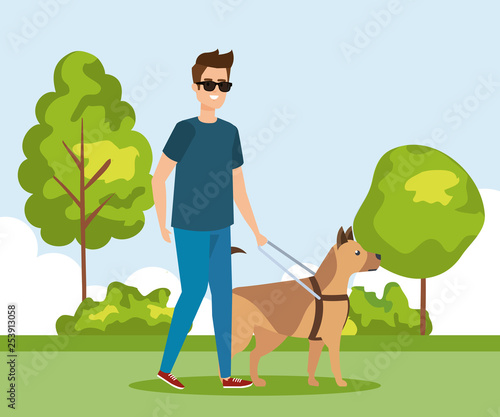 man wearing sunglases and walking with dog
