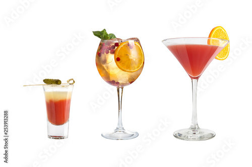 A variety of alcoholic drinks, beverages and cocktails on a white background. Three drinks in glass goblets with original decoration.