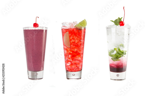 A variety of alcoholic drinks  beverages and cocktails on a white background. Three drinks in glass glasses with decoration.