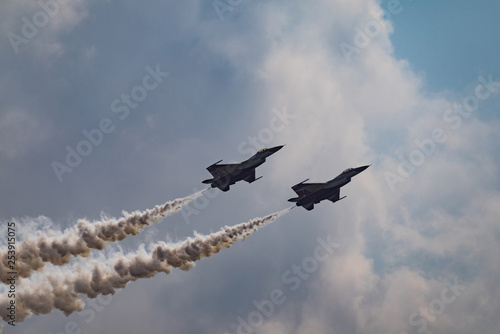 Photography LANGKAWI, MALAYSIA - 20th MARCH 2015; Team Singapore Air Force acrobatic from Singapore with aircraft F-16 Fighting Falcon during LIMA 2015 in Langkawi, Malaysia