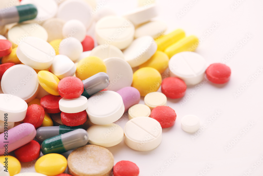 Different colorful tablets at white background Different colorful tablets at white background