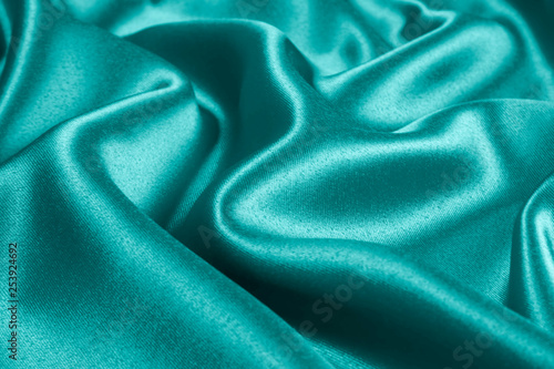 Closeup of rippled light blue satin fabric