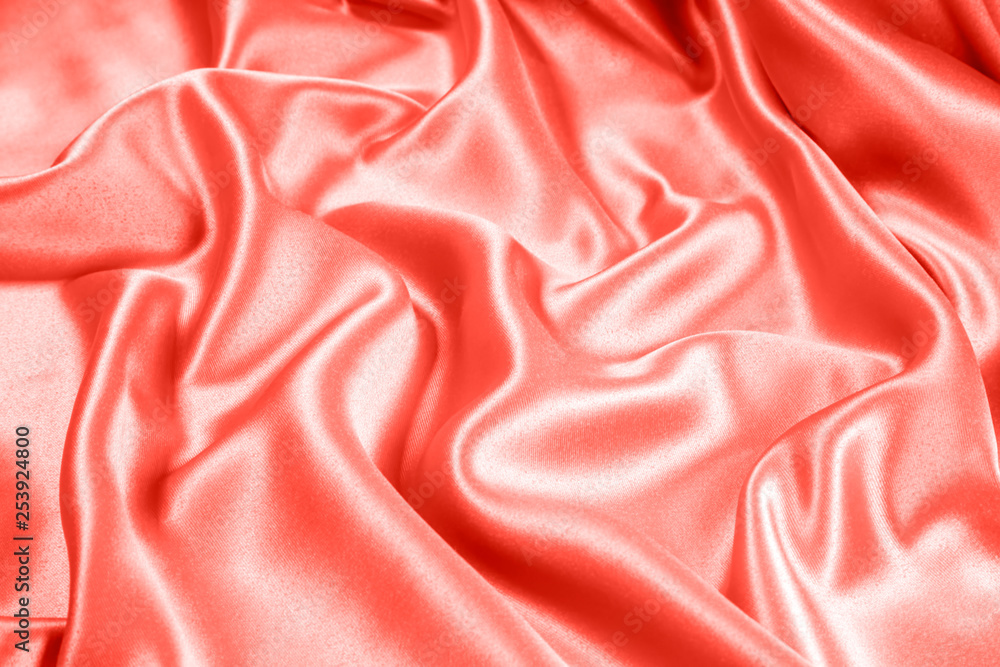 Fototapeta premium Closeup of rippled coral satin fabric