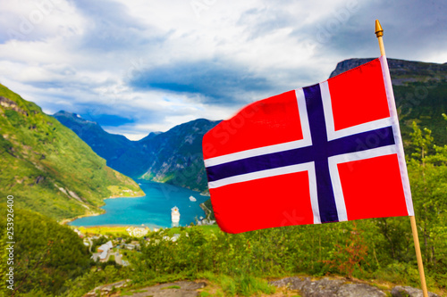 Norwegian flag and Geiranger fjord landscape