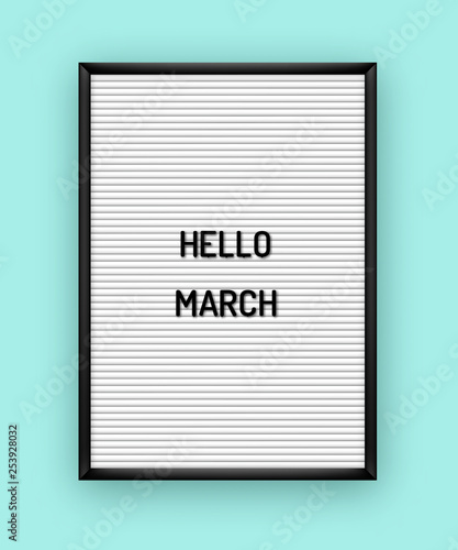 Hello March motivation quote on white letterboard with black plastic letters
