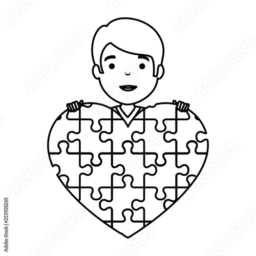 young boy with heart puzzle attached
