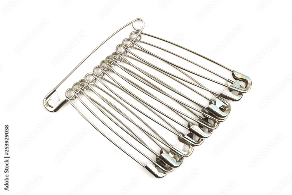 metal safety pins isolated on white background metal safety pins isolated on white background