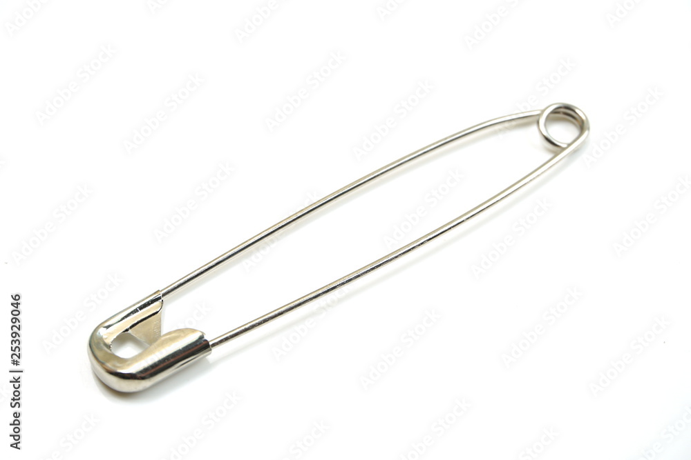 metal safety pins isolated on white background metal safety pins isolated on white background