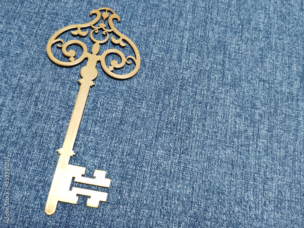 golden key on blue background