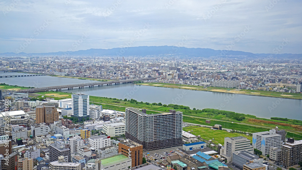 Fototapeta premium Japan Osaka city, buildings, river and bridge from aero view
