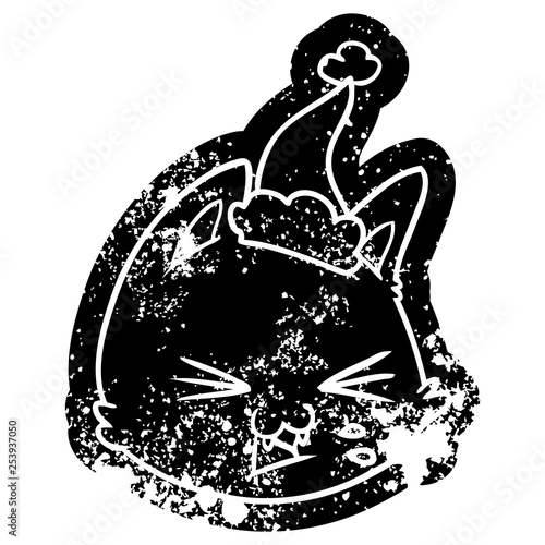 spitting cartoon distressed icon of a cat face wearing santa hat