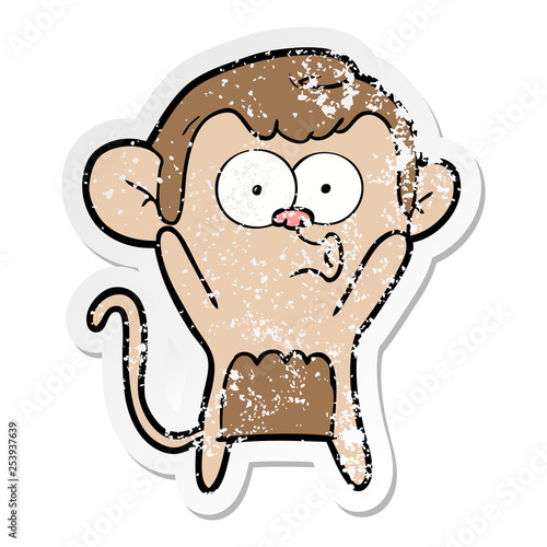 distressed sticker of a cartoon surprised monkey